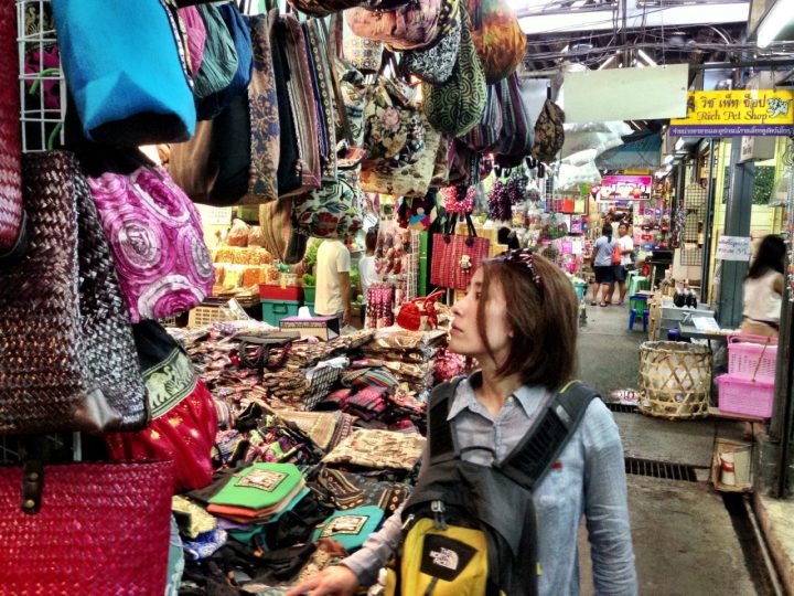 woman traveler visiting in Bangkok, Tourist with backpack and hat  sightseeing in Chatuchak Weekend Market, landmark and popular attractions  in Bangkok, Thailand. Travel in Southeast Asia concept 21601290 Stock Photo  at Vecteezy
