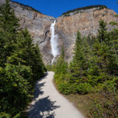 Takakkaw Falls in Yoho National Park during a vibrant sunny summer day